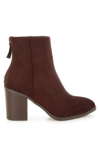 Brown ankle boot on a white background