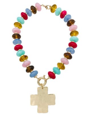 A beaded necklace featuring a variety of colorful round beads in pink, blue, yellow, brown, and turquoise, finished with a hammered gold cross pendant and gold-toned clasp, shown on a plain white background.
