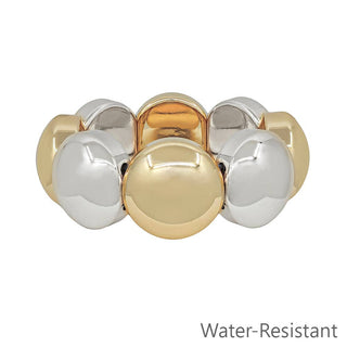 Gold and silver bracelet on a white background with 'Water-Resistant' text.
