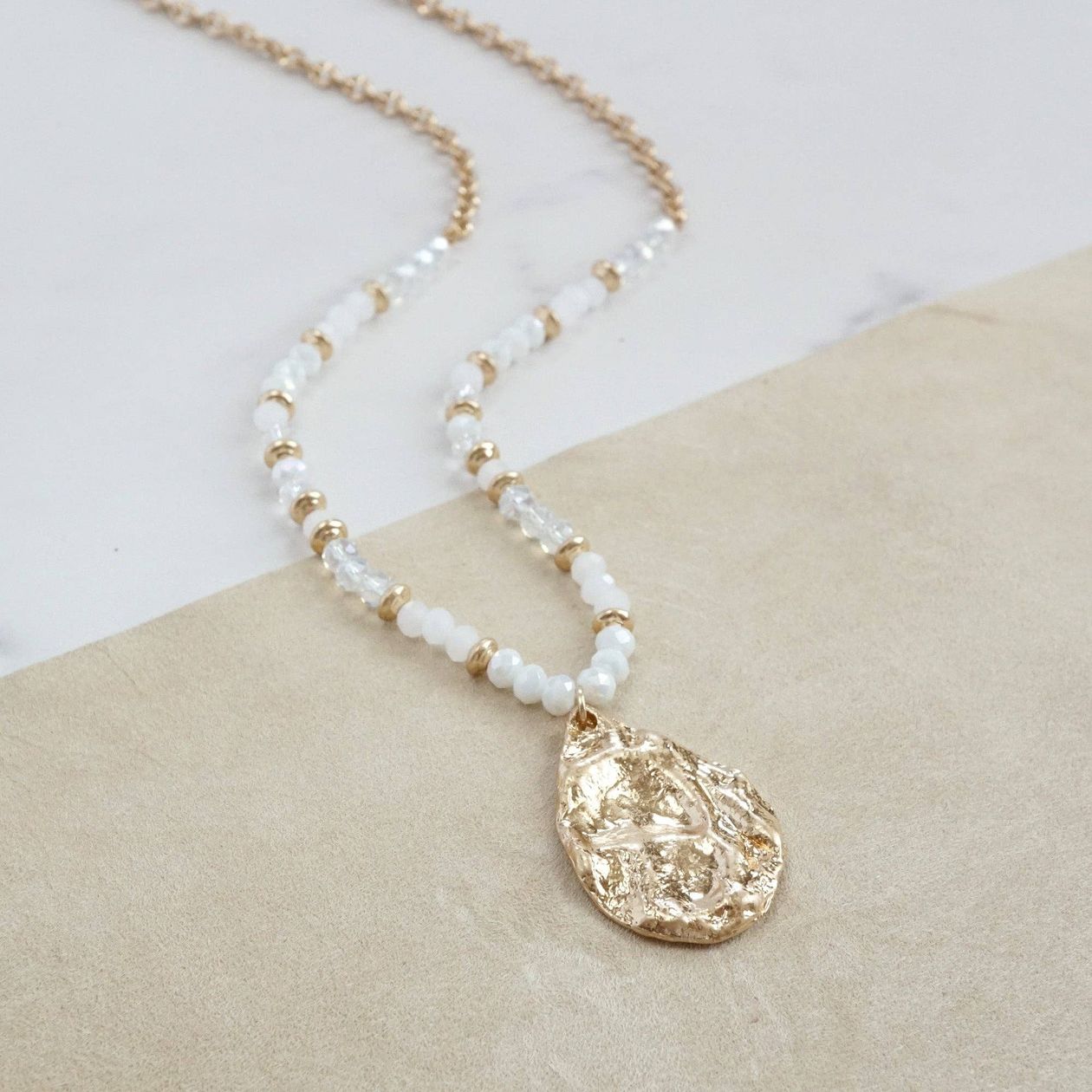 Long Beaded Necklace with Golden Teardrop Pendant