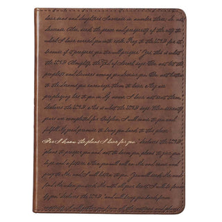 Brown leather notebook with handwritten text on a white background