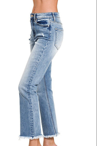 Light blue jeans worn by a person on a white background