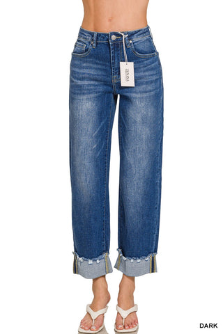 Blue jeans with a tag on a white background