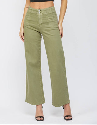 A woman modeling a pair of olive green wide-leg cropped pants with a black sleeveless crop top, standing against a light gray studio background.
