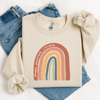 Beige sweatshirt with rainbow design and text on a white background