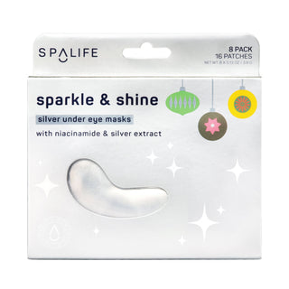 SPALIFE Sparkle & Shine silver under eye masks in retail packaging, featuring a white box with a die-cut window showing one silver crescent-shaped mask and holiday ornament graphics.