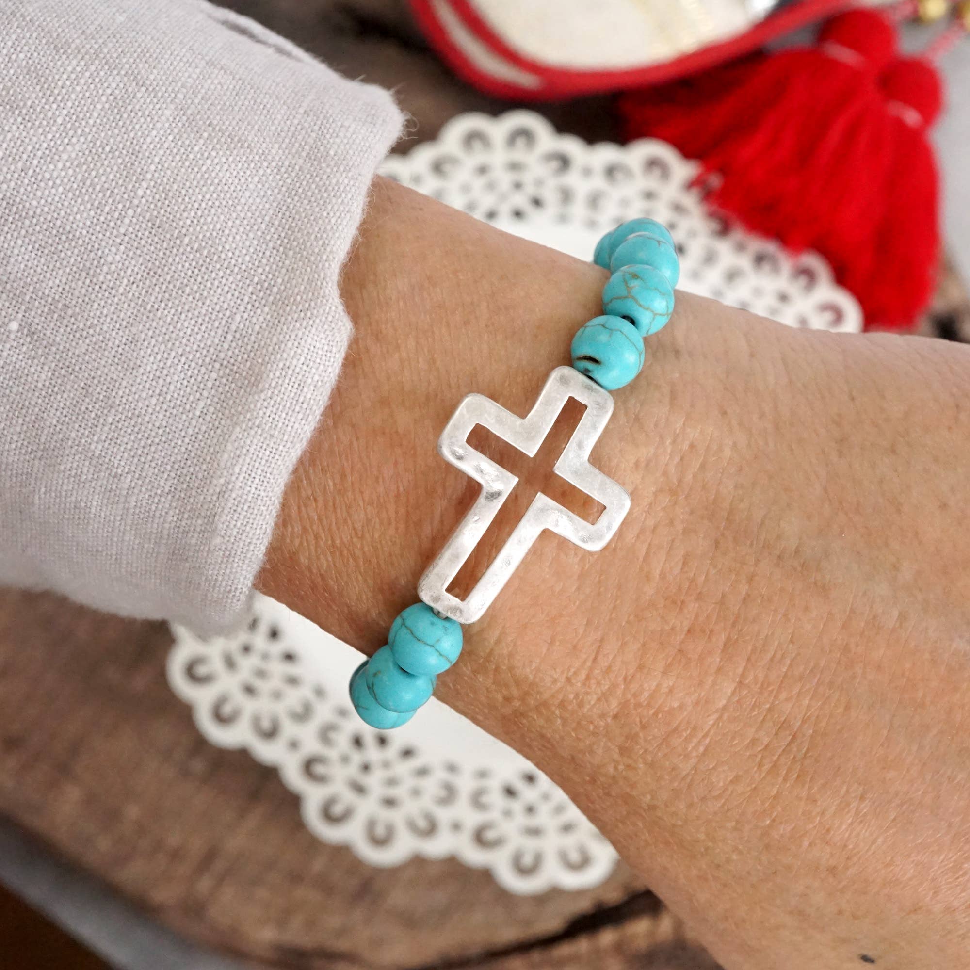 Cross bracelet with Turquoise color beads and silver hammered cross