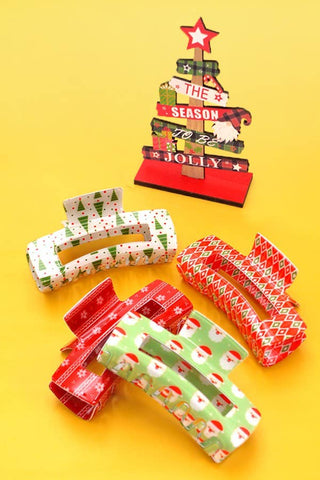  Christmas claw clips designs on a yellow background
