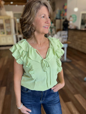 Sleeveless Making Moves Ruffle Detail Top in Sage