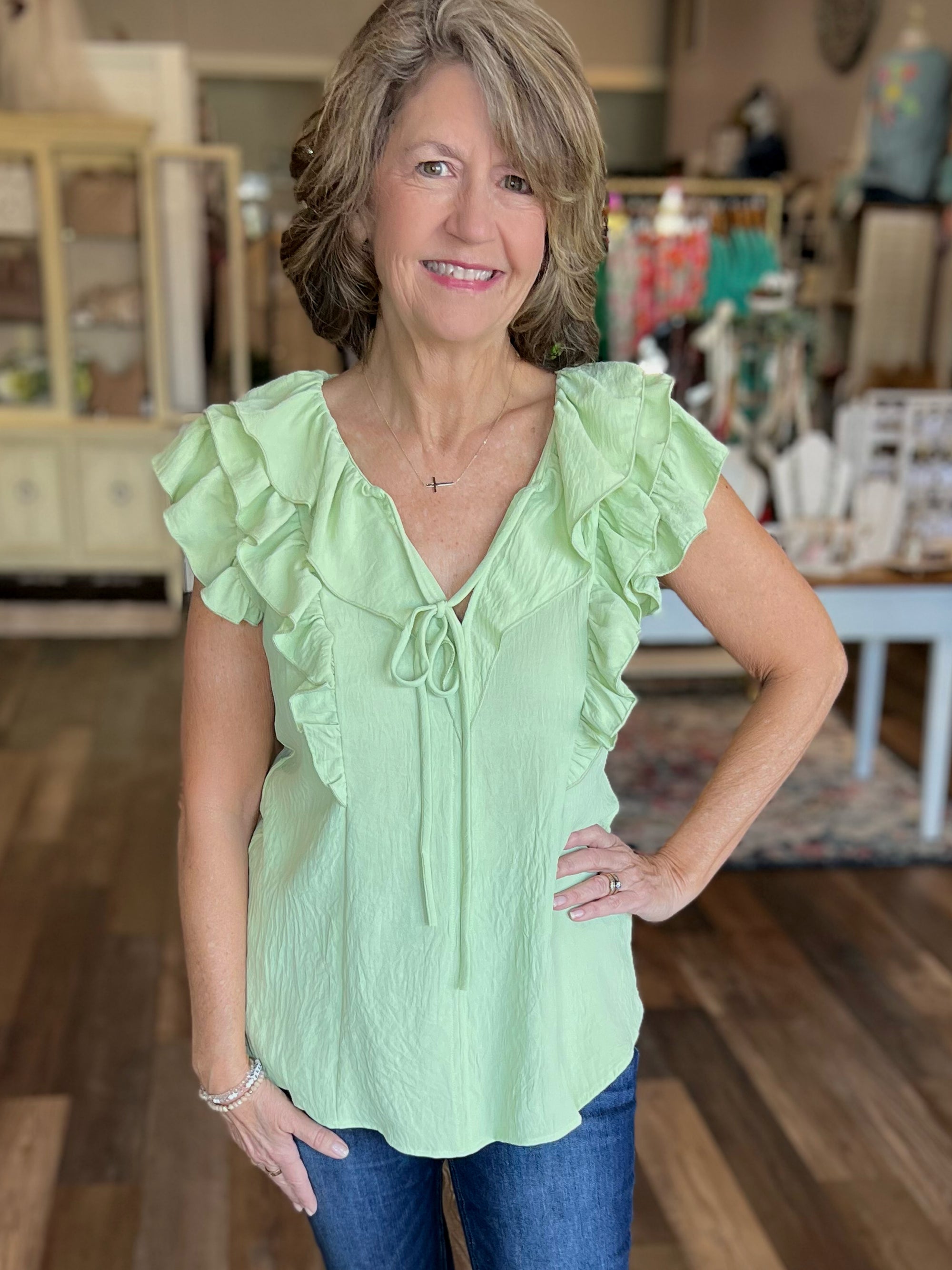 Sleeveless Making Moves Ruffle Detail Top in Sage