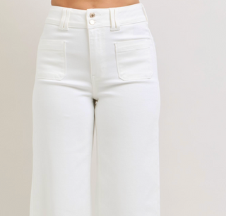 White jeans on a beige background