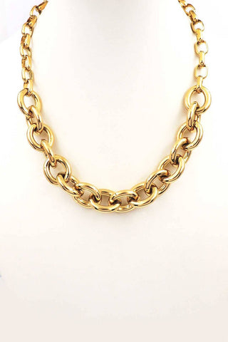 A chunky gold chain necklace with large interlocking links, displayed on a plain white background.