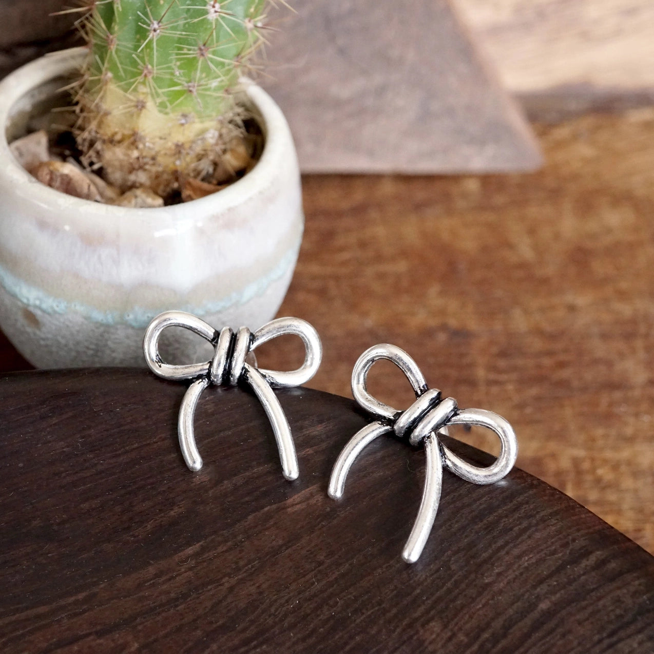 Western Bow Statement Earrings in Silver