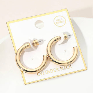 Gold hoop earrings on a branded card with 'Cylinder Back' text.