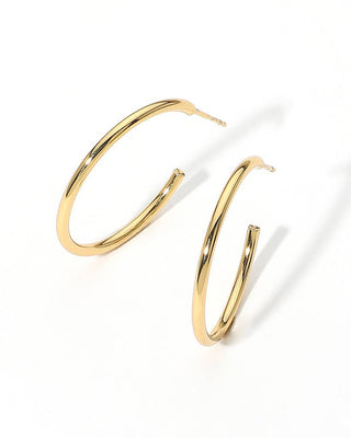Gold hoop earrings on a white background