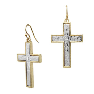 Gold and silver cross-shaped earrings on a white background
