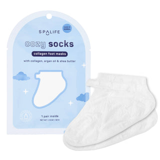 A pair of white collagen foot masks displayed next to their light blue packaging pouch, which features the brand name 'SPALIFE' and product name 'COZY SOCKS'.
